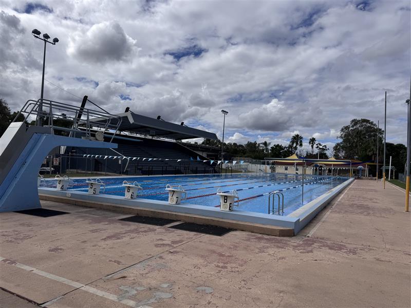 Outdoor 50m pool with grand stand in background